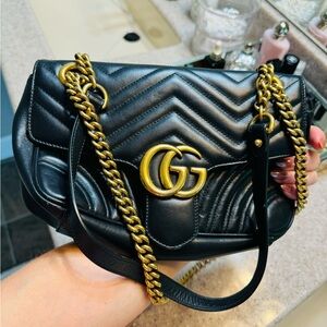 This is an authentic GUCCI Calfskin Matelasse Small GG Marmont in Black.
